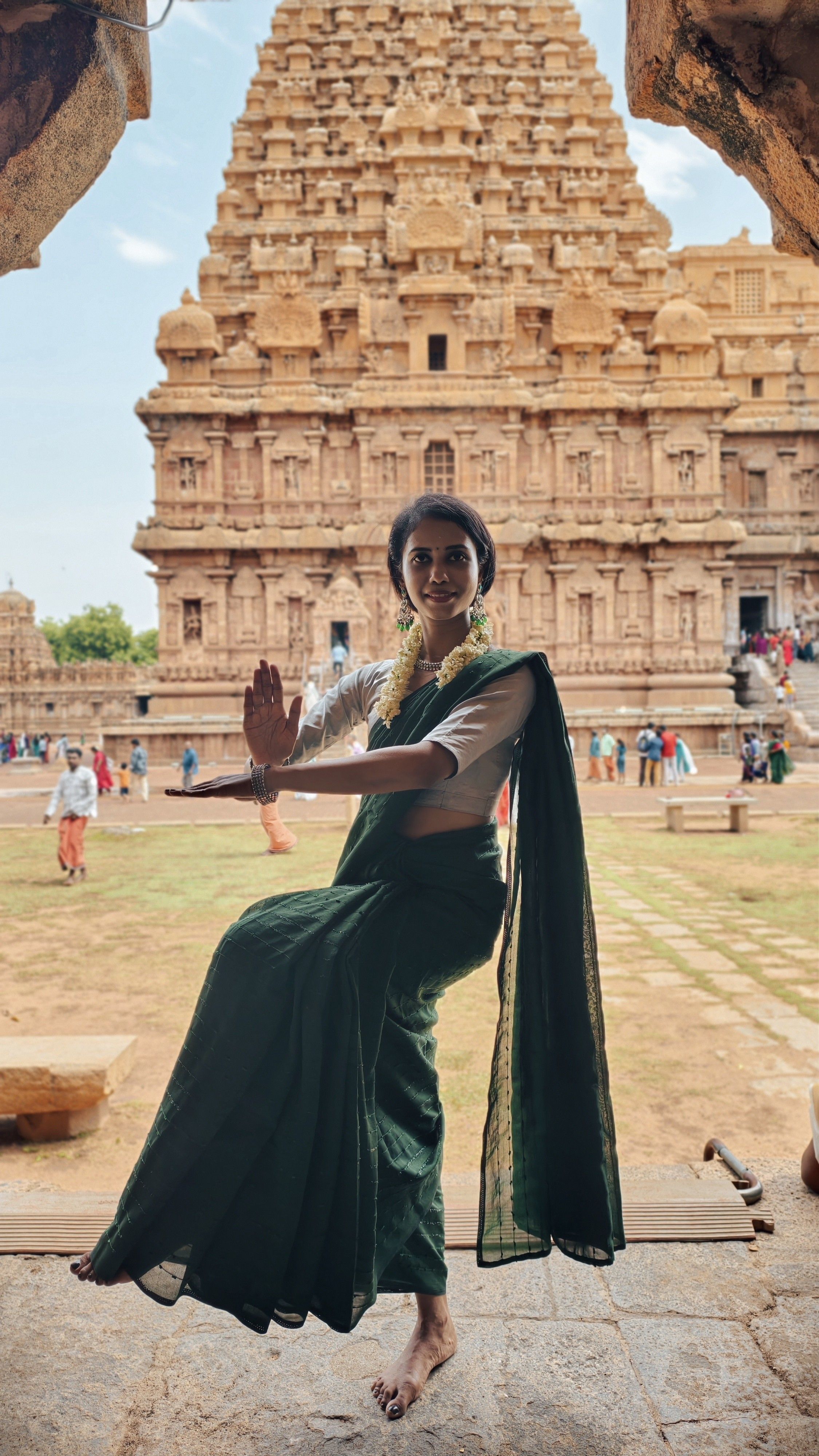 A Bharatanatyam dancer poses elegantly at the historic Brihadeeswarar Temple in Thanjavur, India.
