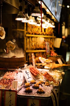 Colorful display of traditional Japanese street food under warm lights.