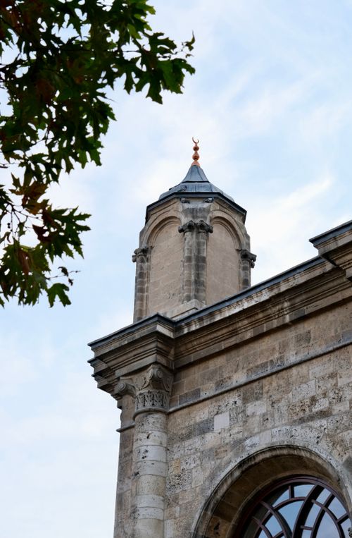 Free Close-up of an old building's architectural features and tower against the sky. Stock Photo