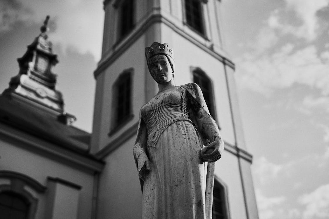 Woman Statue Near Building