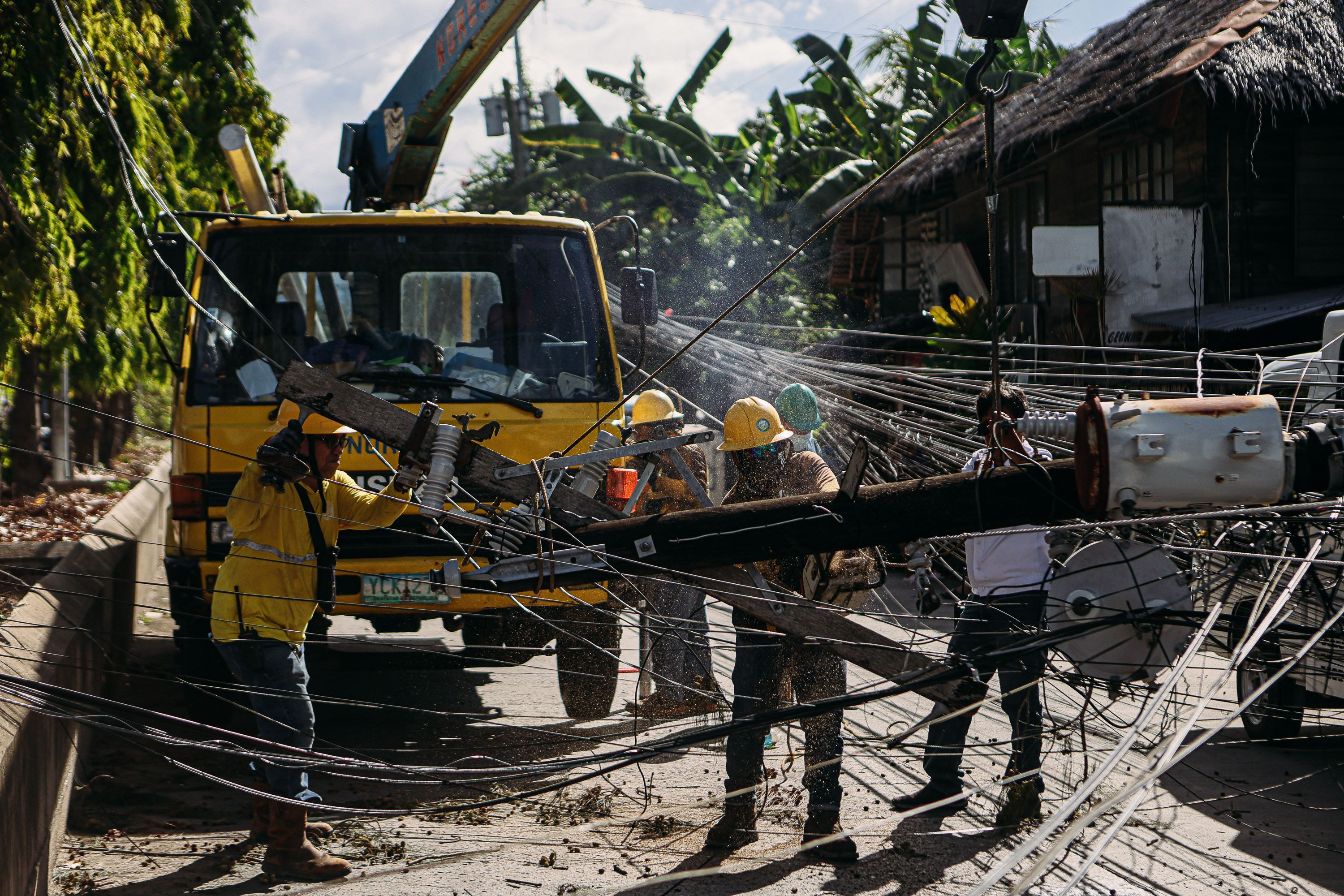 Utility Workers Fixing Power Lines on City Street · Free Stock Photo