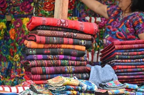 Free Vibrant handwoven textiles displayed at Sumpango market in Guatemala. Stock Photo