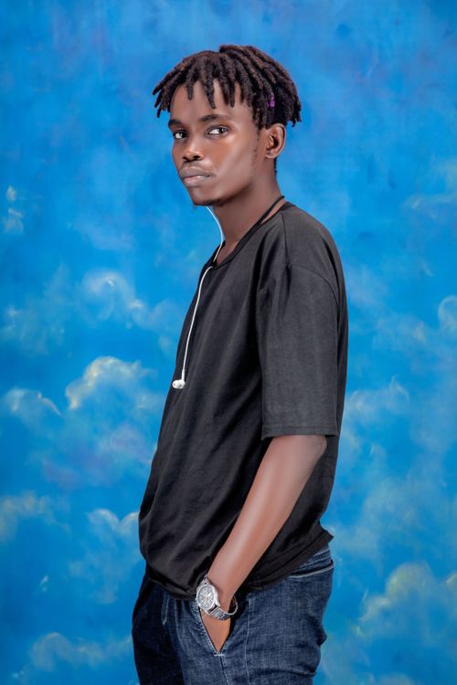 Stylish Young Man Against Vibrant Blue Background · Free Stock Photo