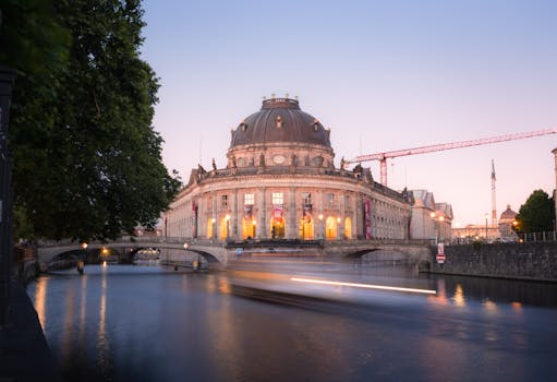 Twilight view of Bode Museum with reflected lights in Berlin, Germany.