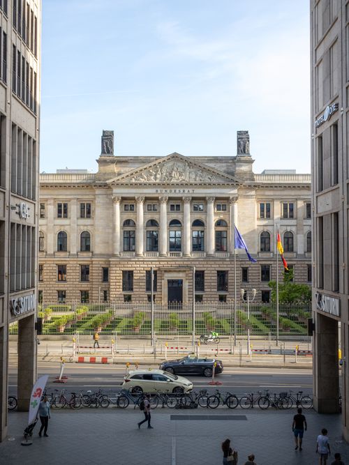 Free View of the historic Bundesrat building in Berlin with pedestrians and bicycles. Stock Photo