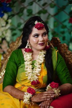 A beautifully adorned South Asian bride in traditional attire, exuding elegance and joy.