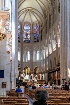 Explore the breathtaking architecture of Notre-Dame Cathedral in Paris with its majestic stained glass and arches.