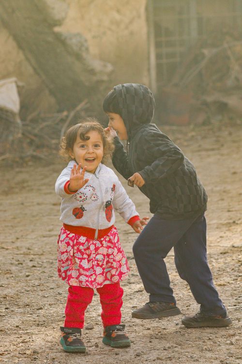 Free Two happy children playing outside, capturing joy and childhood innocence. Stock Photo