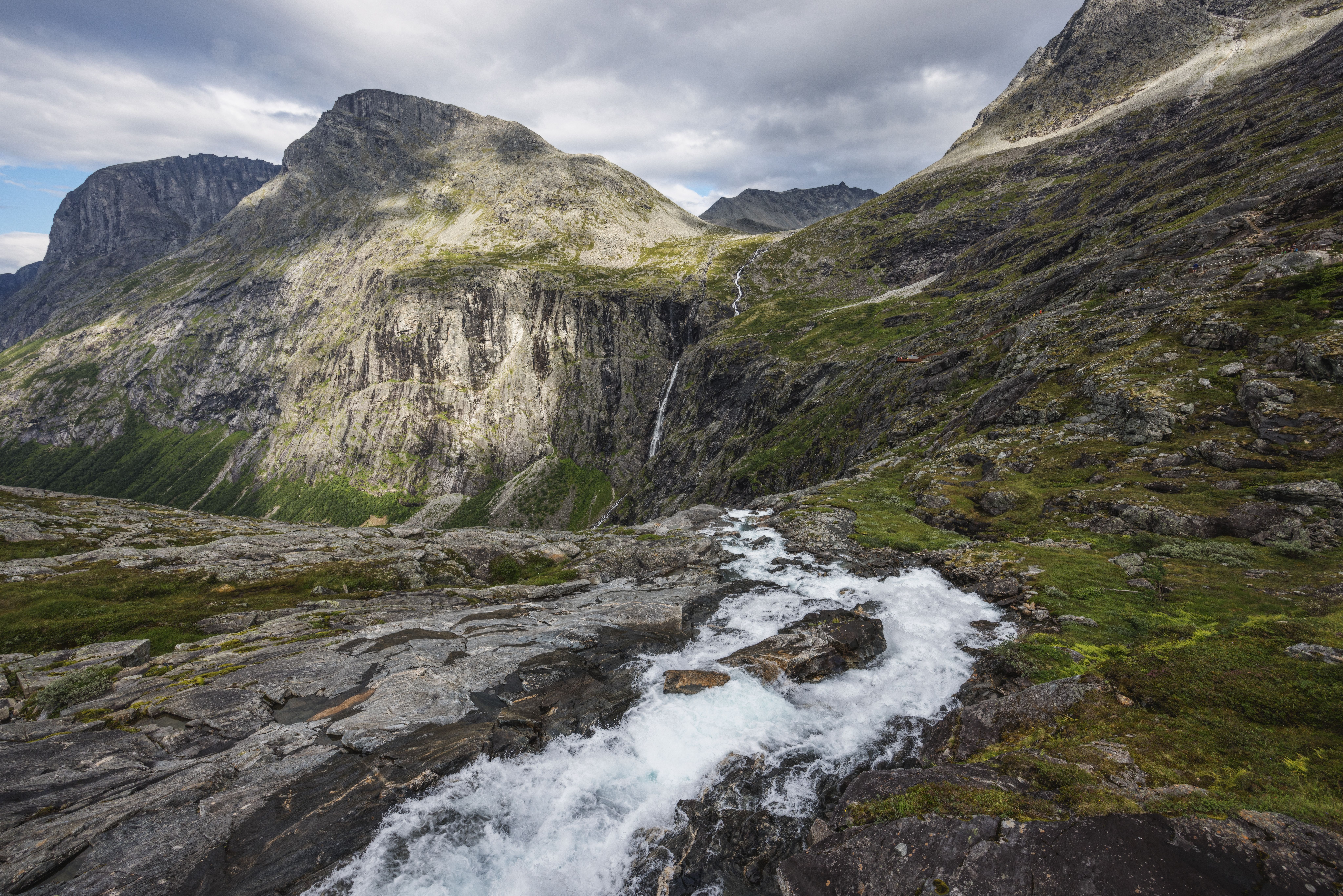 Breathtaking Minibus Northern Lights Chase with Photography from Tromsø Review 2026 - Majestic mountain scene featuring a flowing stream and rugged terrain.