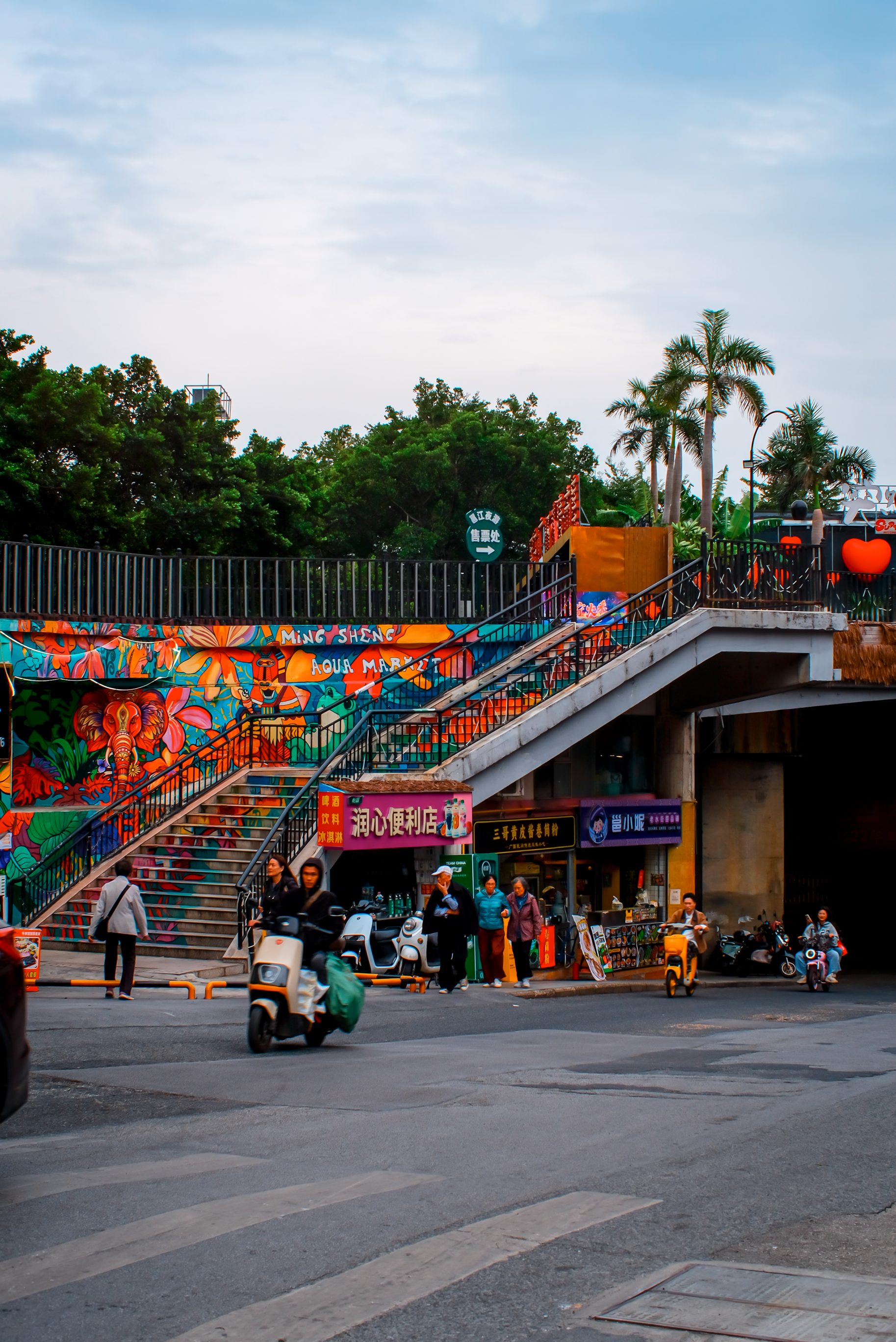 Vibrant Urban Street Scene with Colorful Murals · Free Stock Photo