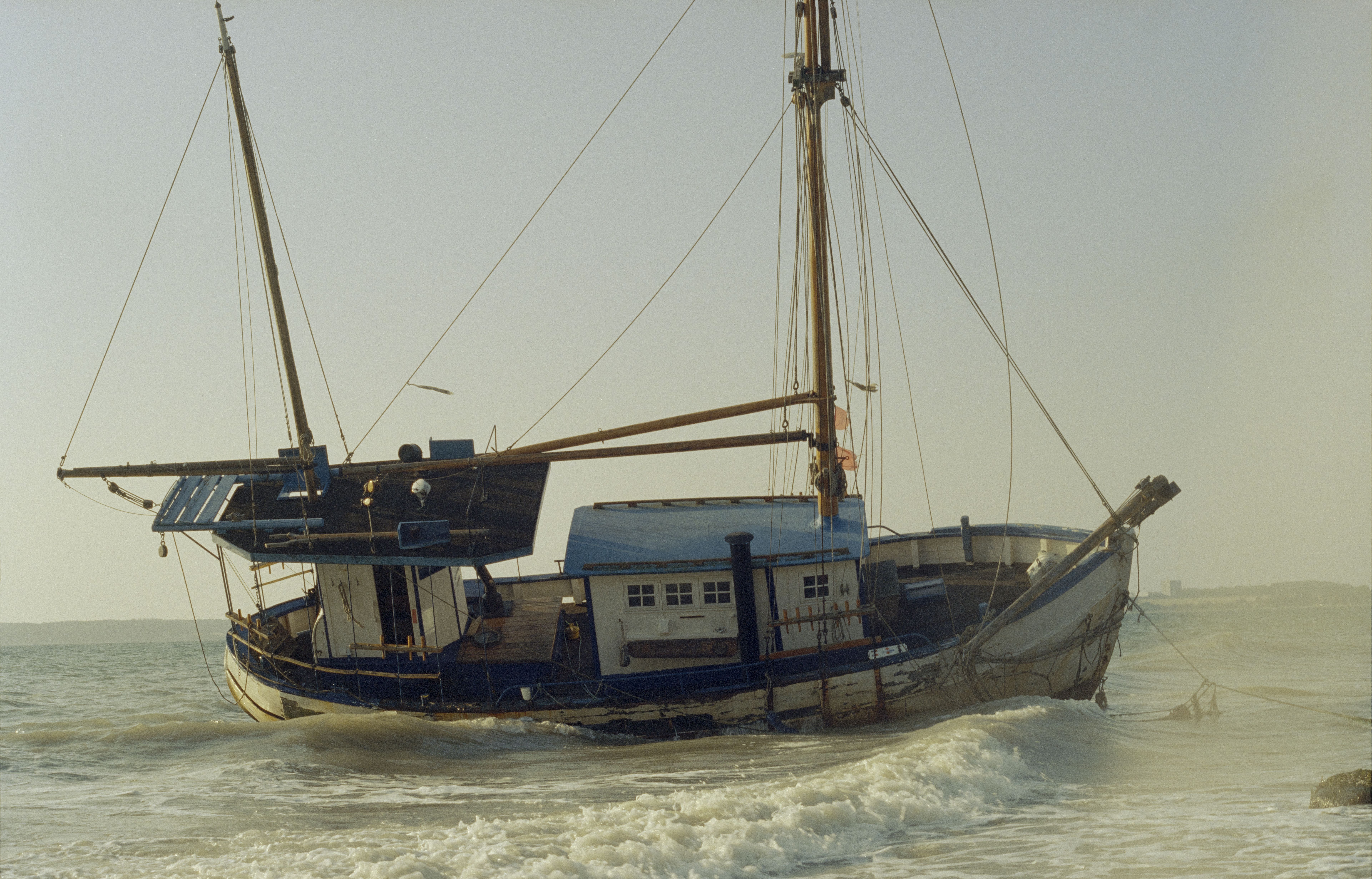 A vintage wooden ship on the shores of Snaptun, Denmark, during daytime.