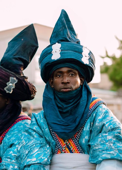 Free Colorful portrait of a man in traditional Nigerian attire during a cultural event, showcasing vibrant fabrics and designs. Stock Photo