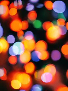 A vibrant display of colorful bokeh lighting, creating an abstract and artistic blur effect.