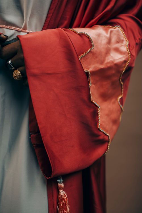 Elegant Traditional Red Robe with Gold Trim · Free Stock Photo