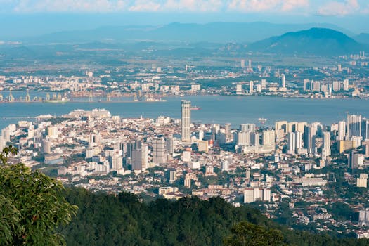 Aerial view of George Town skyline from Bukit Bendera, showcasing Penang's urban landscape and scenic beauty.