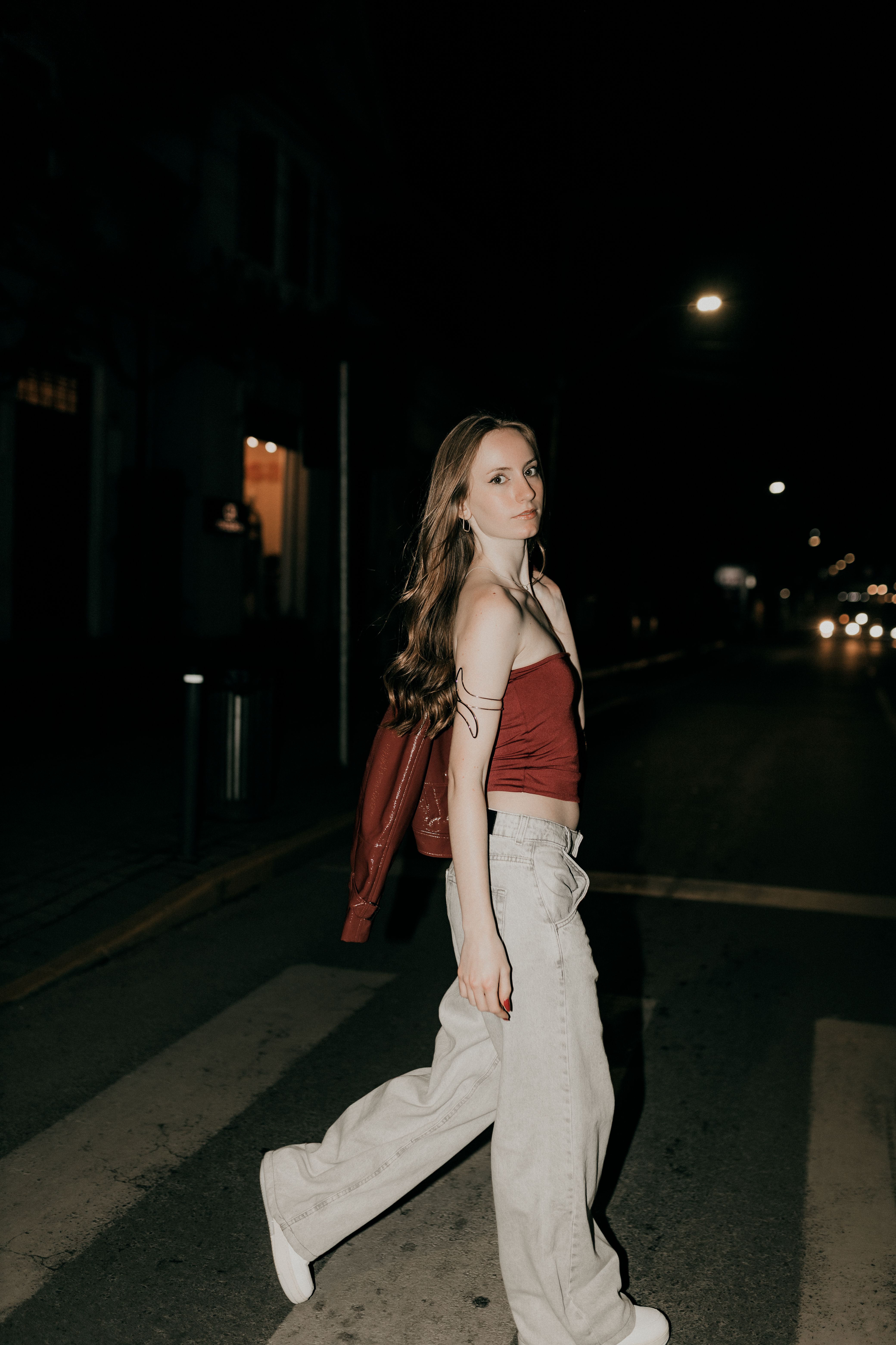 Young Woman Strolling on Night City Street · Free Stock Photo