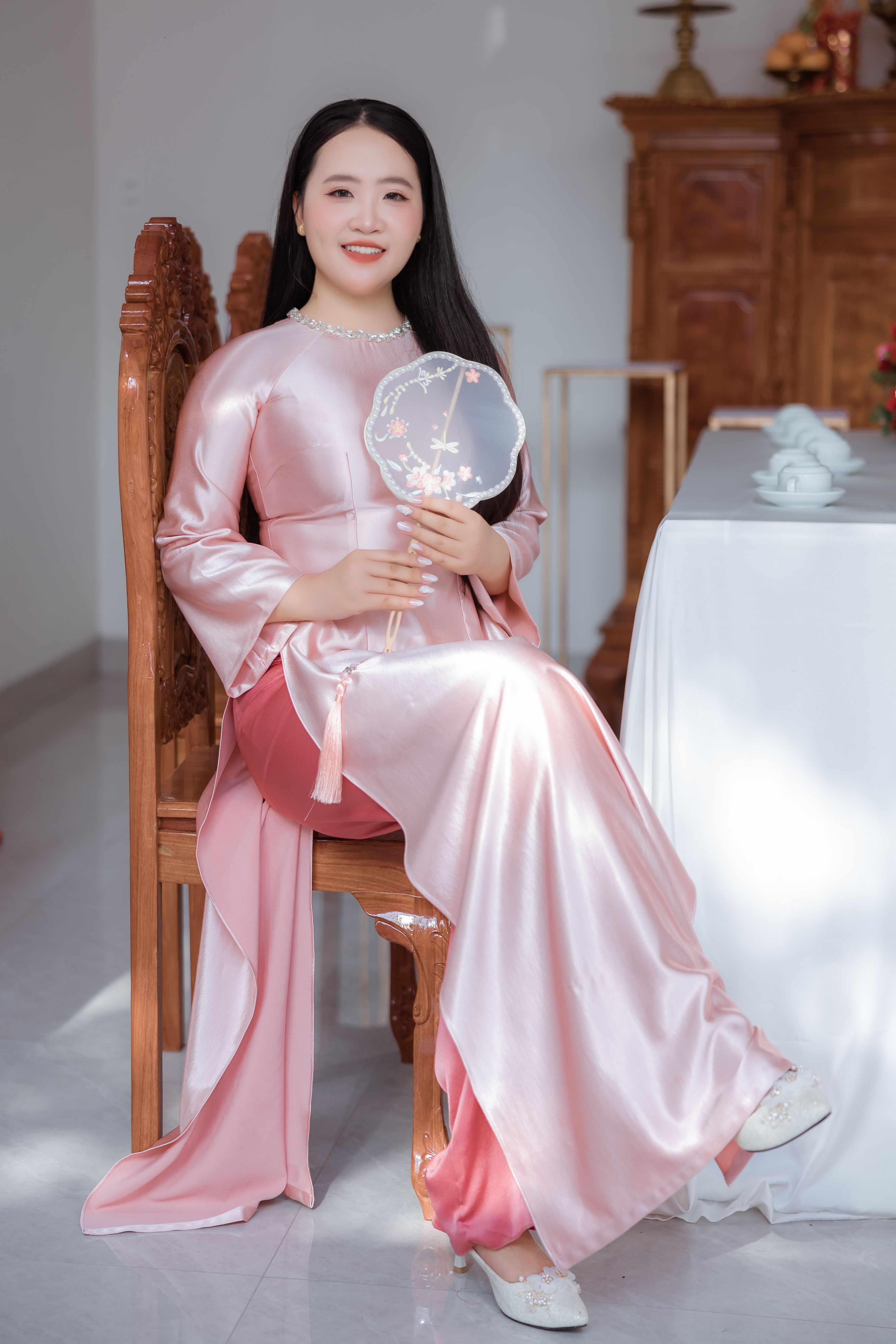 Elegant Woman in Traditional Pink Gown Indoors · Free Stock Photo