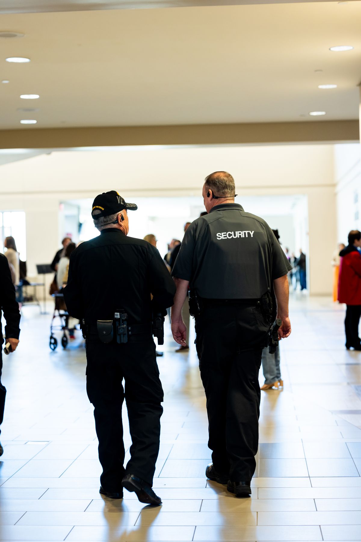 Two security officers patrolling an indoor public space