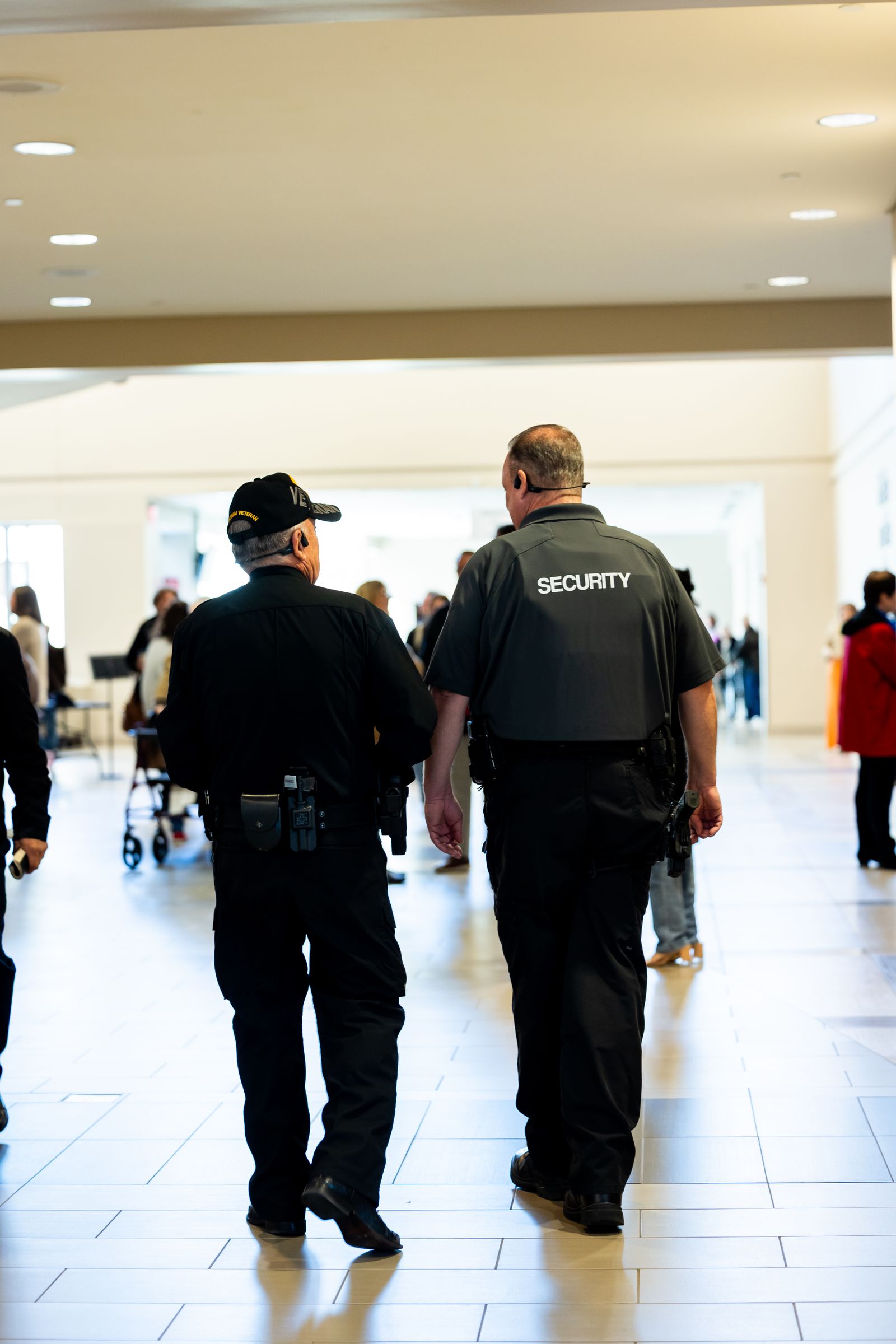 Security personnel patrolling an indoor commercial property