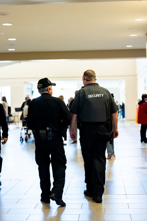 a security personnel patrolling an indoor mall area