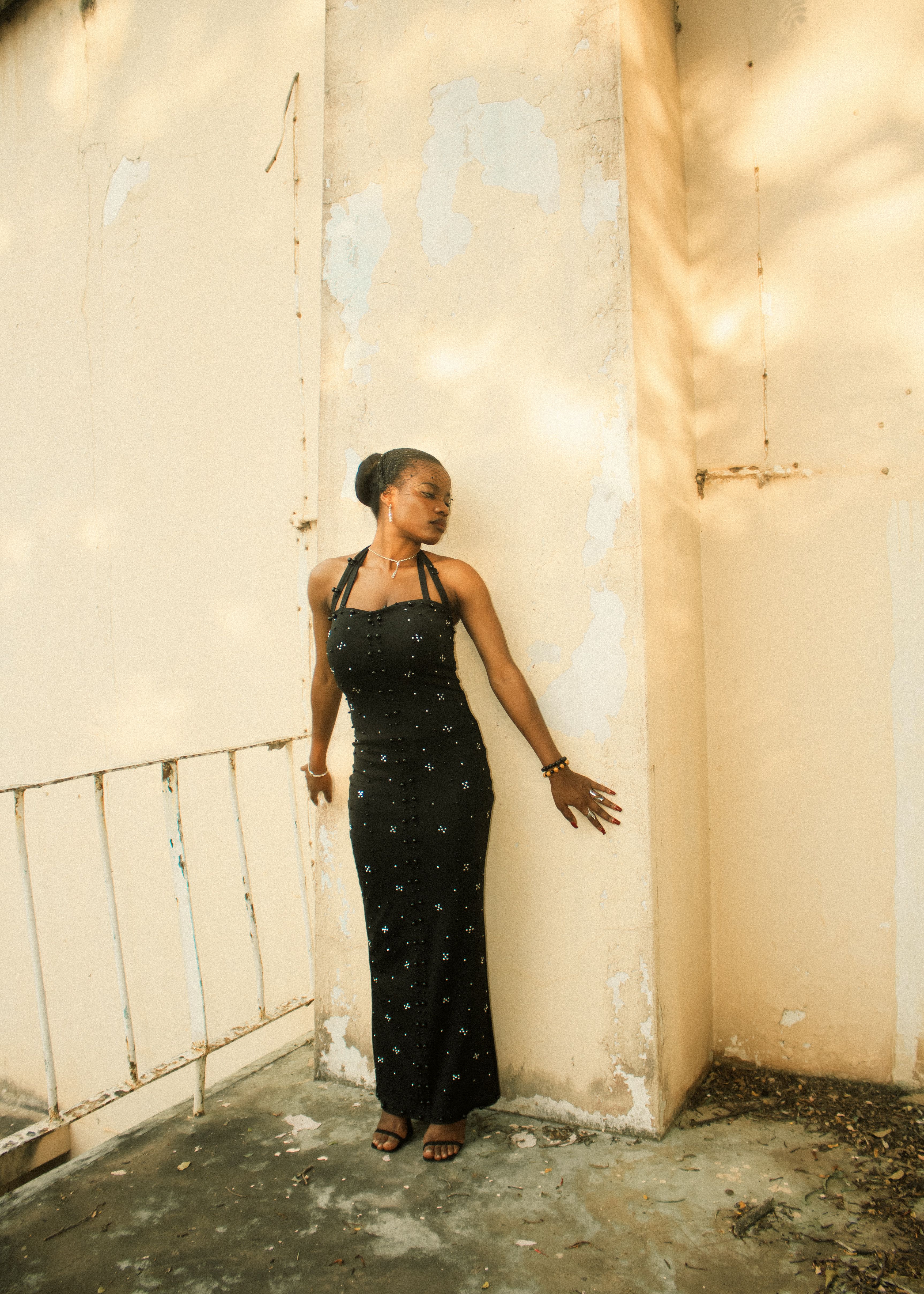 Elegant Woman Posing in Black Dress Outdoors · Free Stock Photo