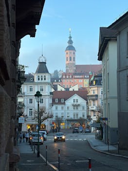 A picturesque view of Baden-Baden with historic buildings and a landmark tower in the background.