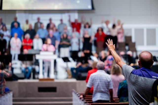 Church members gathered together smiling in fellowship