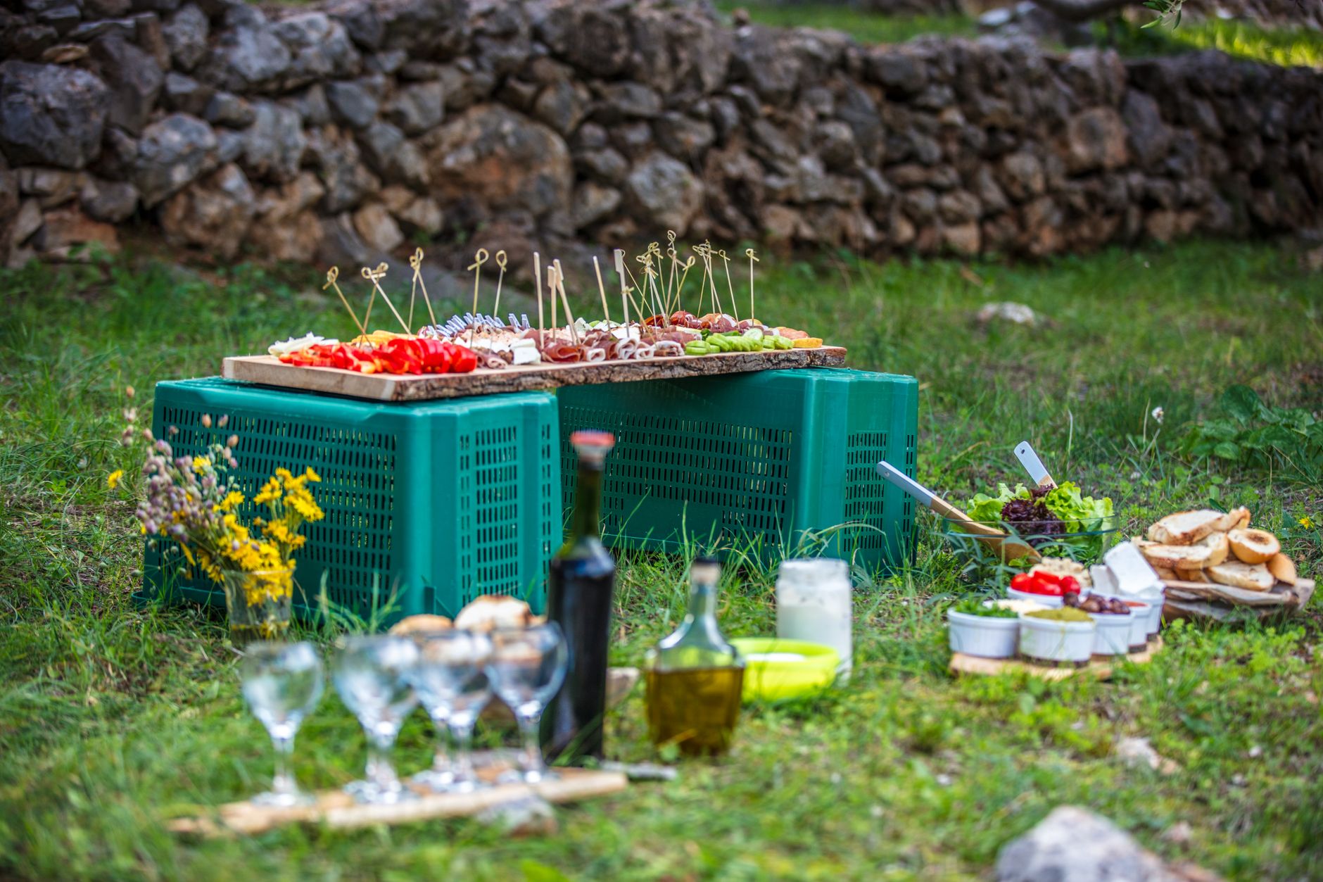 Marinated feta and olive skewers on a wooden board