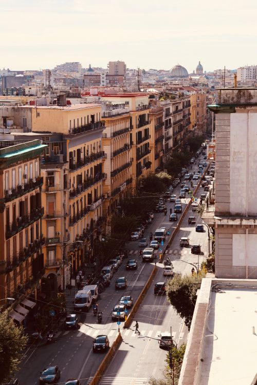 Free A bustling city street in Naples, Italy, captured from above, showing vibrant urban life. Stock Photo