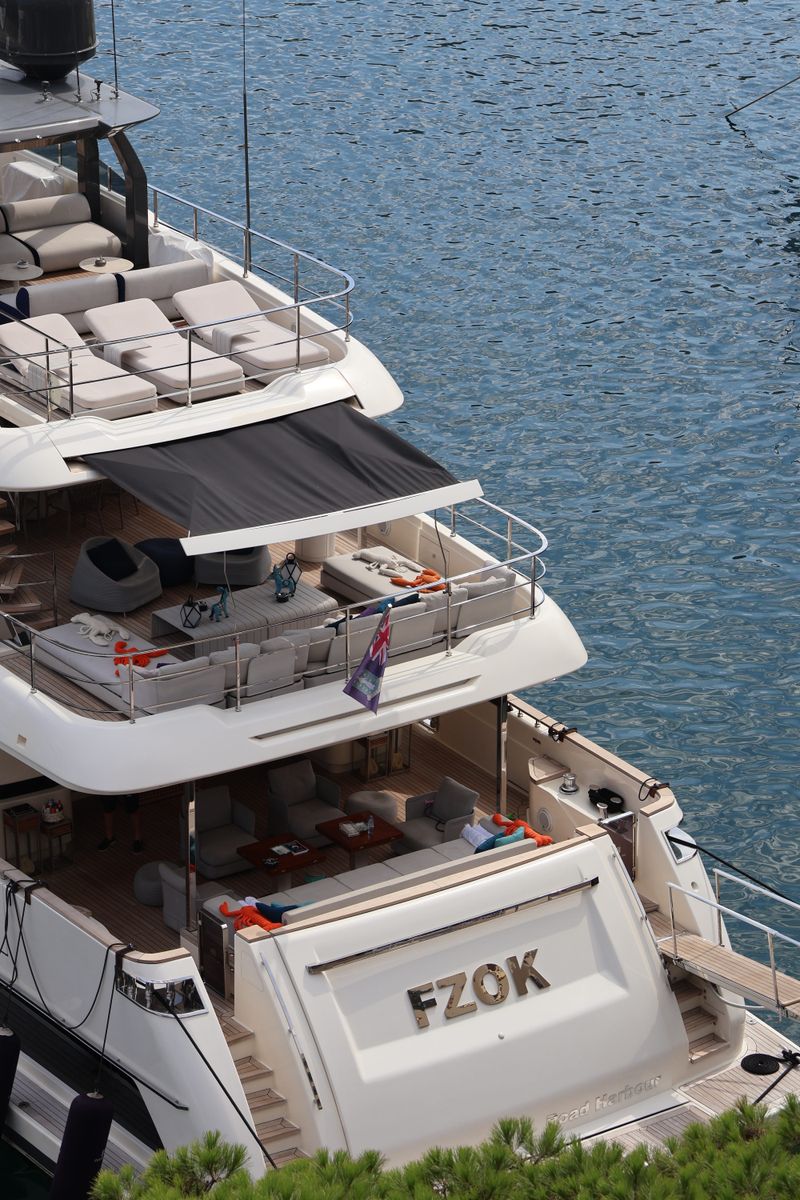 Plus yacht moored off the coast on a sunny day