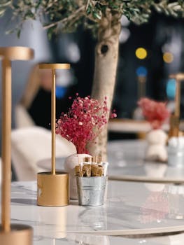 Elegant café setting with stylish table decor and ambient lighting.