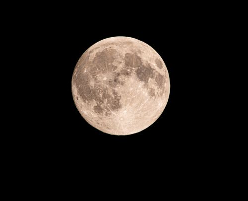 Free A breathtaking capture of the full moon against a black night sky, showcasing lunar details. Stock Photo