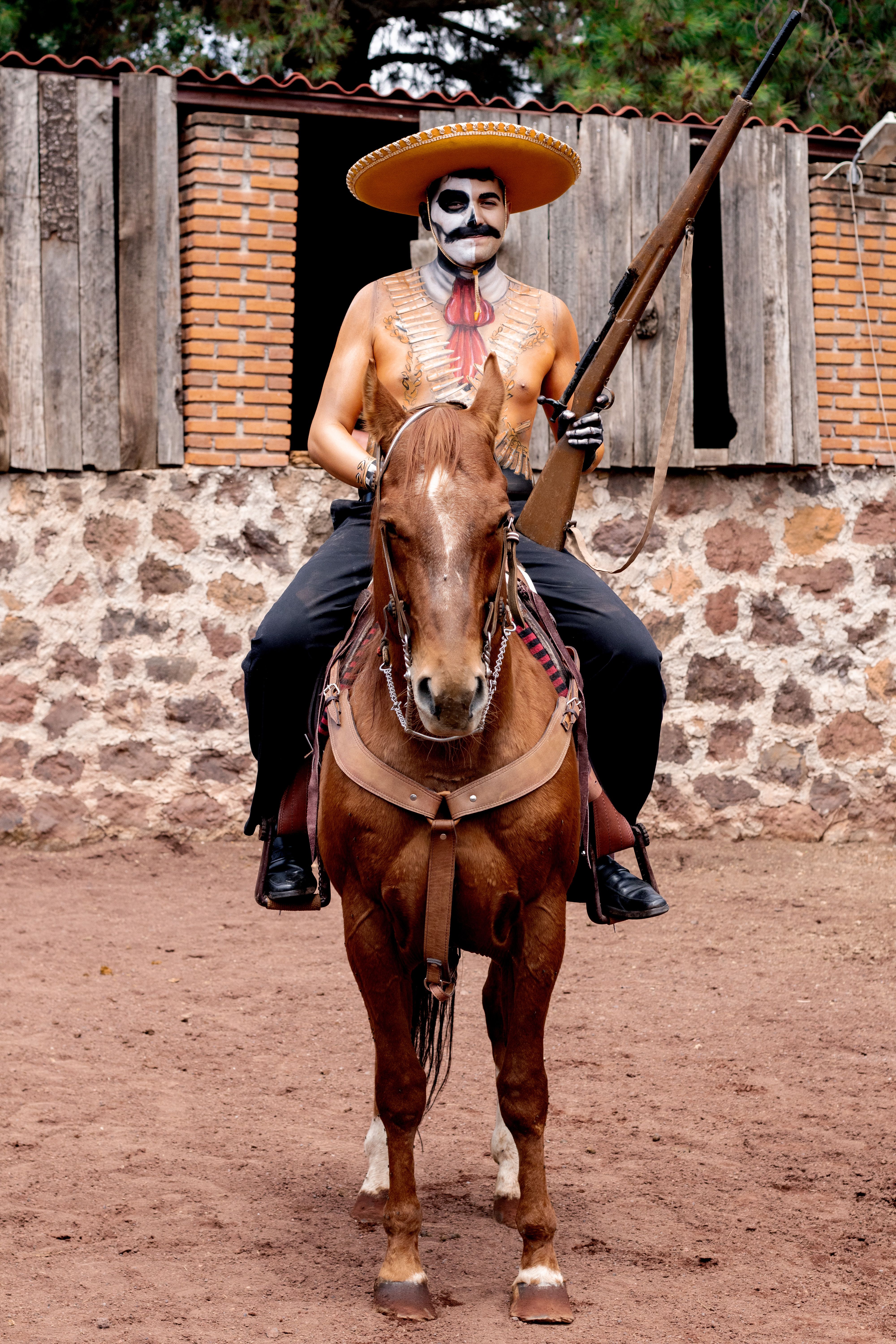 Mexican Rider in Traditional Costume with Skull Face Paint · Free Stock ...