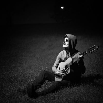 Granite Anthems cover — seated guitarist by Gallery BY IMAN on Pexels
