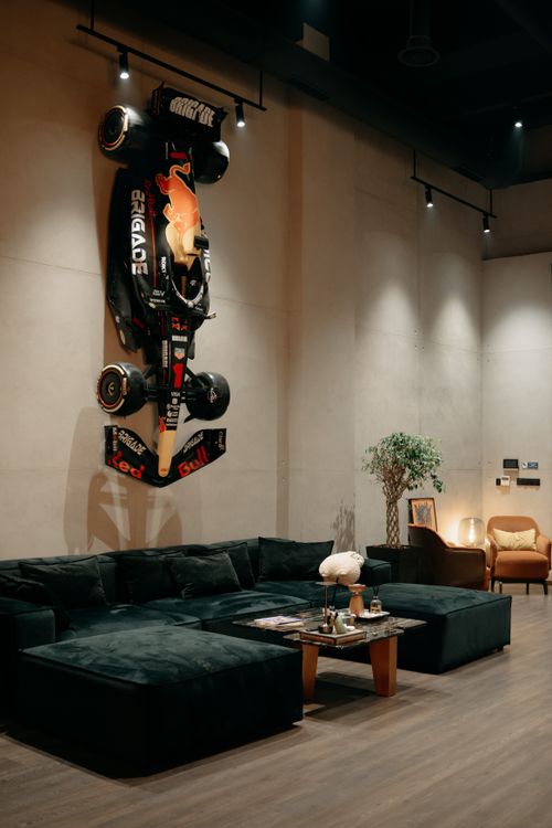 Modern Living Room with Upside Down Race Car Decor · Free Stock Photo
