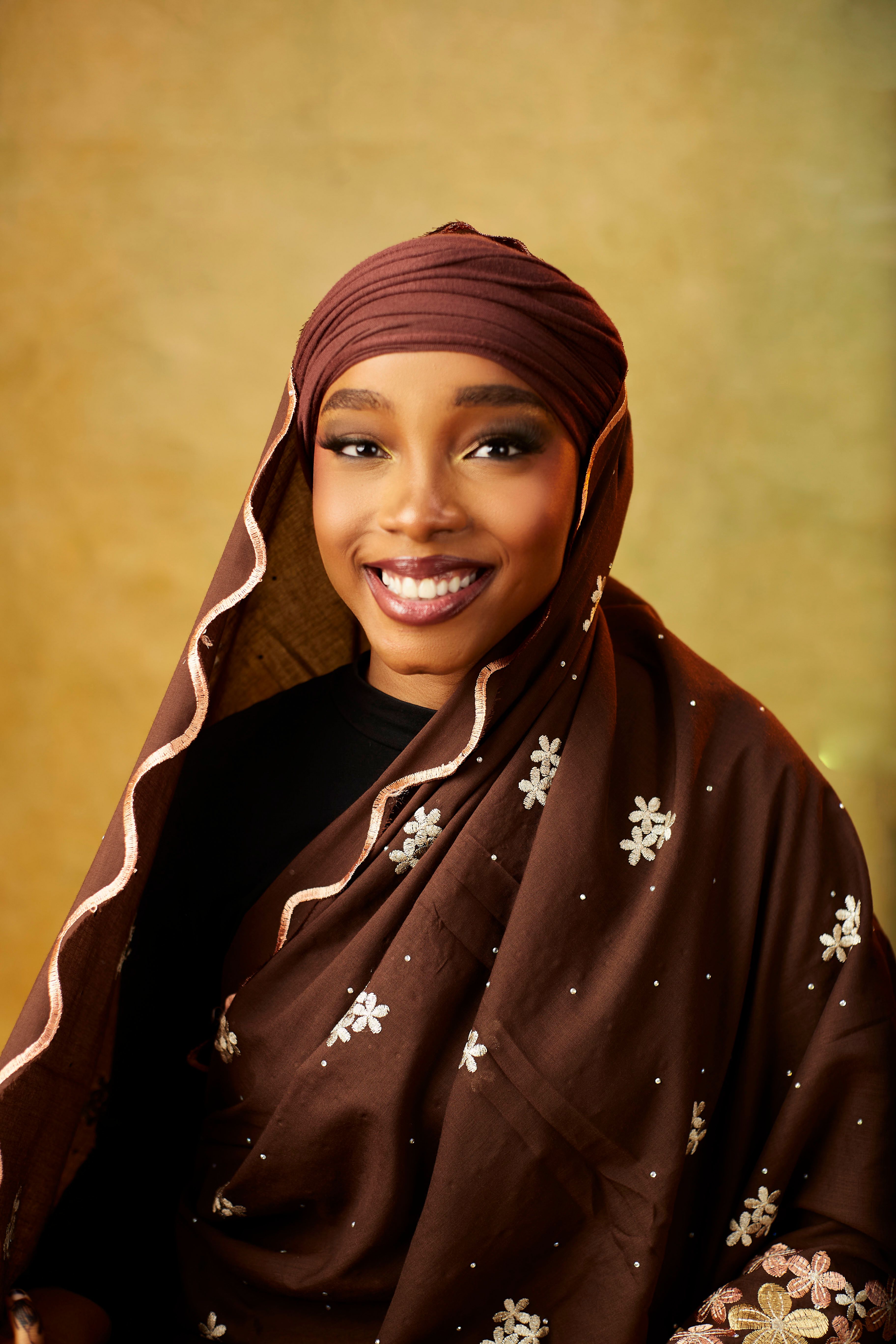 Portrait of Smiling Woman in Traditional Attire · Free Stock Photo