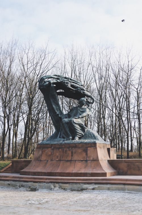 Free Stunning view of the Chopin Monument surrounded by winter trees in Warsaw. Stock Photo