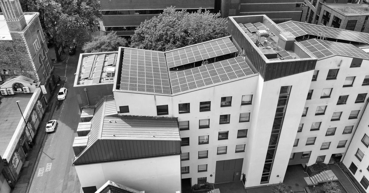 Green Building Landscape: Overview of modern, eco-friendly buildings in a UK cityscape.