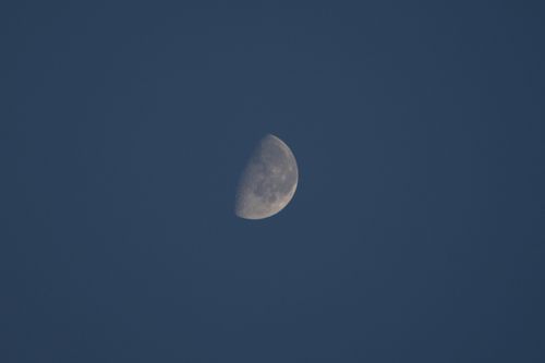 Free A serene view of a half moon in the night sky, captured in Corfu, Greece. Stock Photo