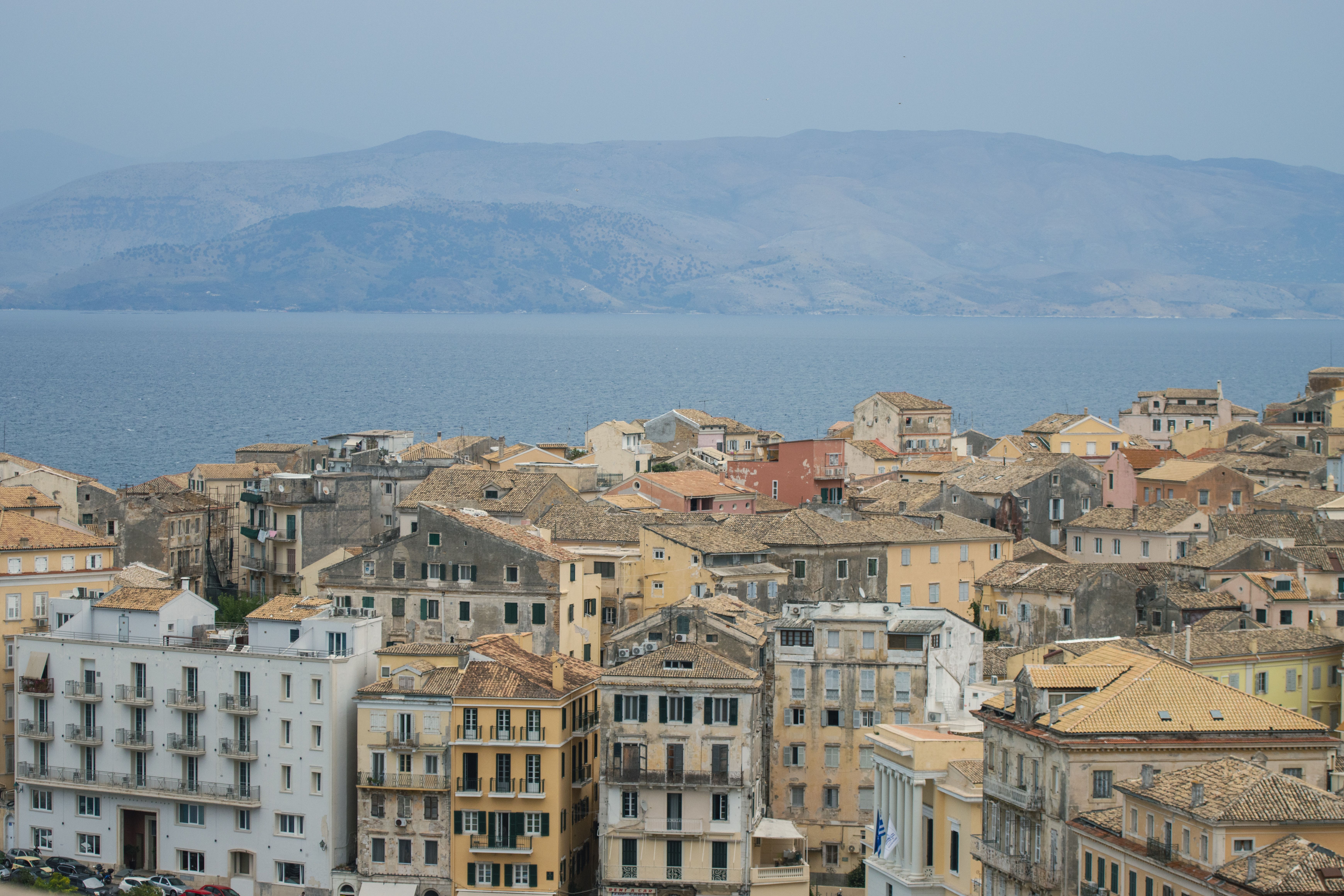 Discover the charming Venetian architecture of Corfu with a stunning coastal backdrop.