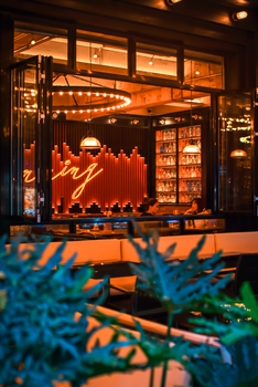 Elegant indoor dining area illuminated by warm, ambient lighting creating a cozy atmosphere.