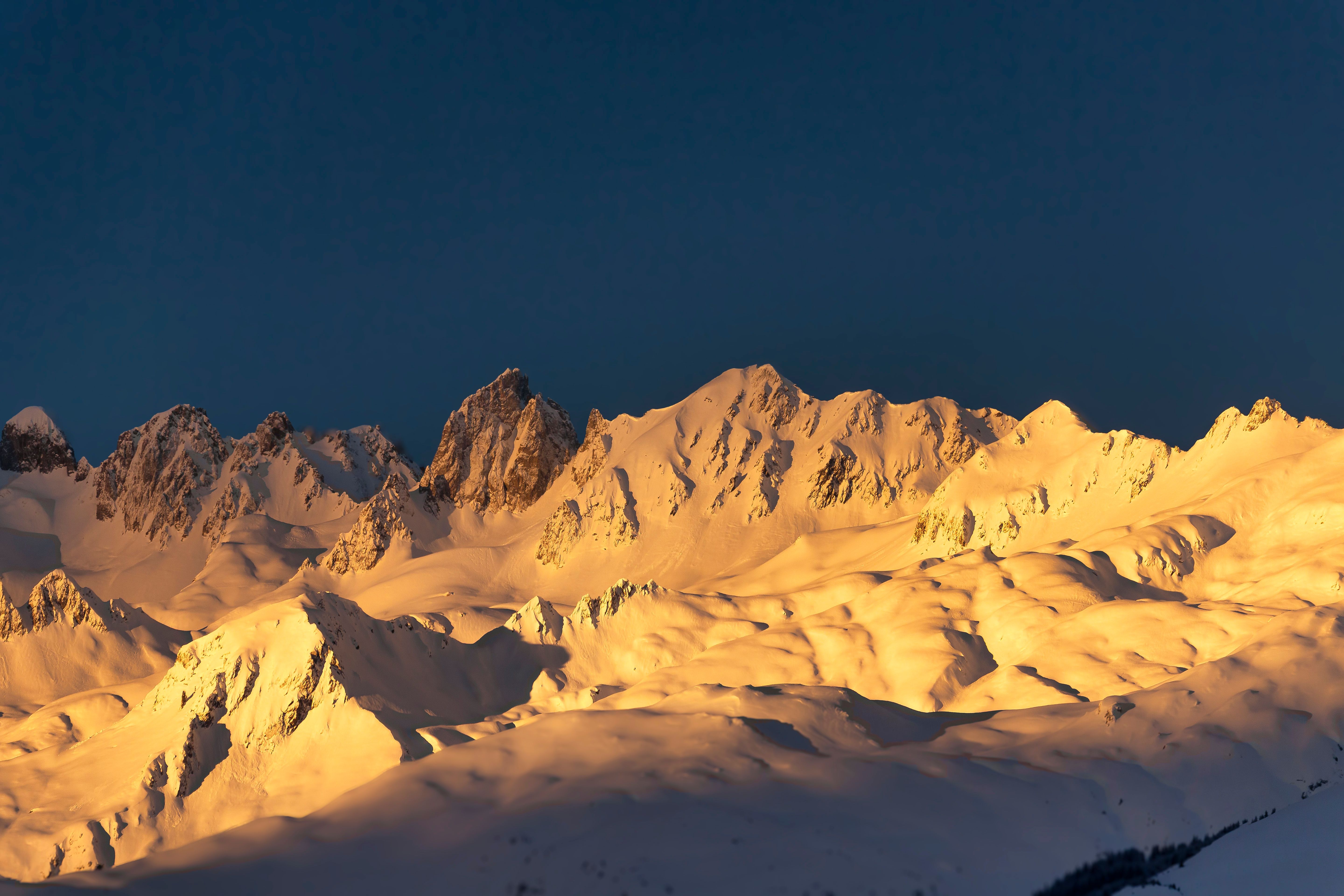Golden Sunset on Snowy Mountain Peaks · Free Stock Photo