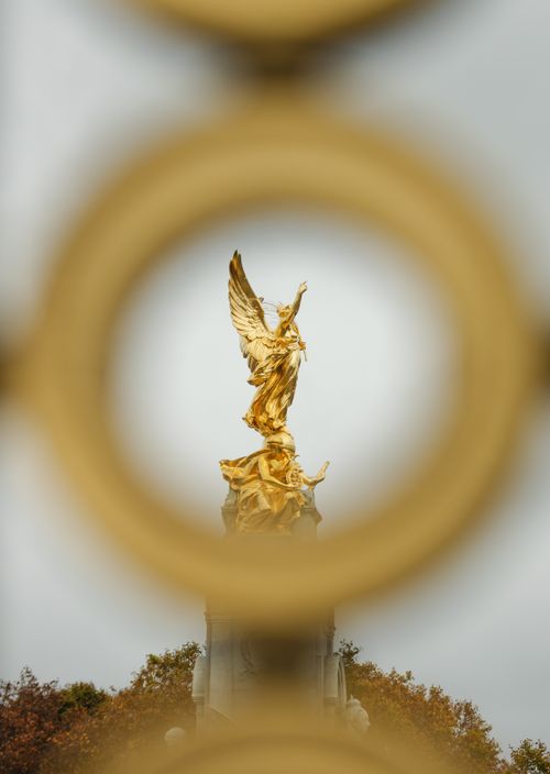 Free Golden angel statue framed by circles at the Queen Victoria Memorial, London, outdoors in autumn. Stock Photo