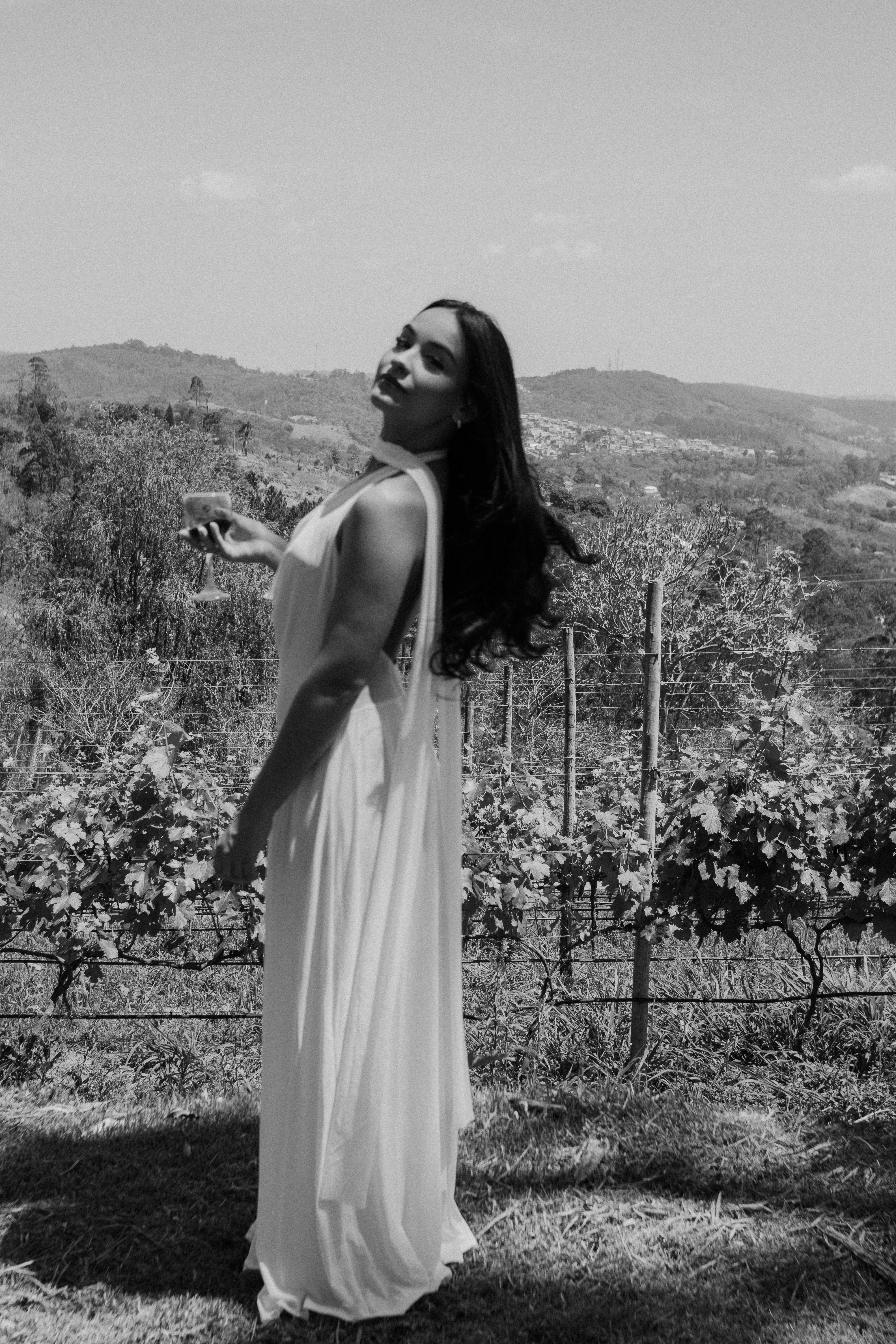 Elegant Woman in White Dress in Vineyard  Free Stock Photo