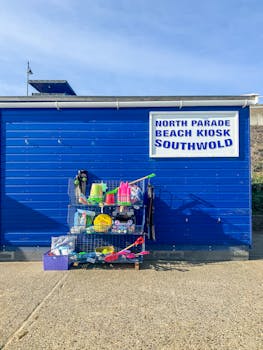Vibrant beach kiosk with toys and gear in Southwold, England.