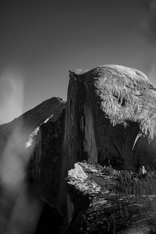 Free Stunning black and white photo of Half Dome, Yosemite National Park, showcasing its towering presence against a clear sky. Stock Photo