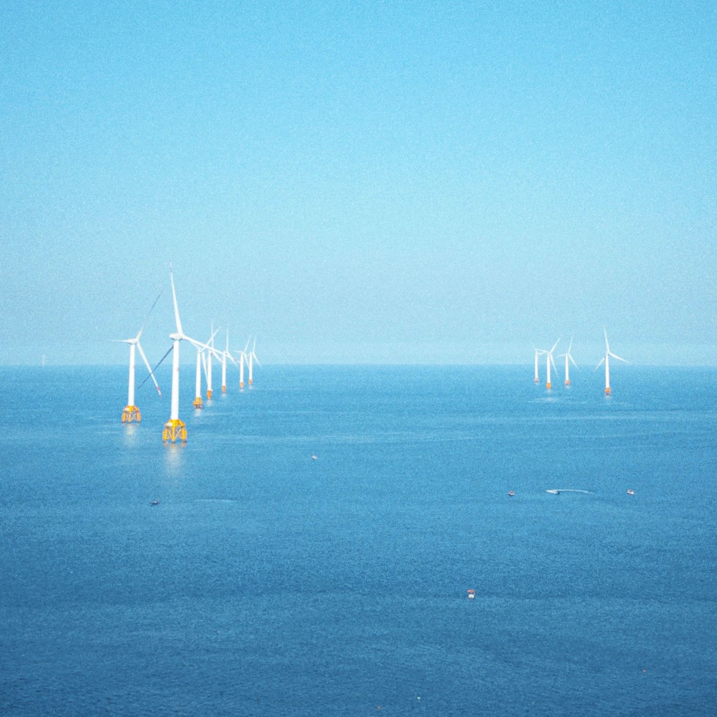 Aerial view of offshore wind turbines at sea