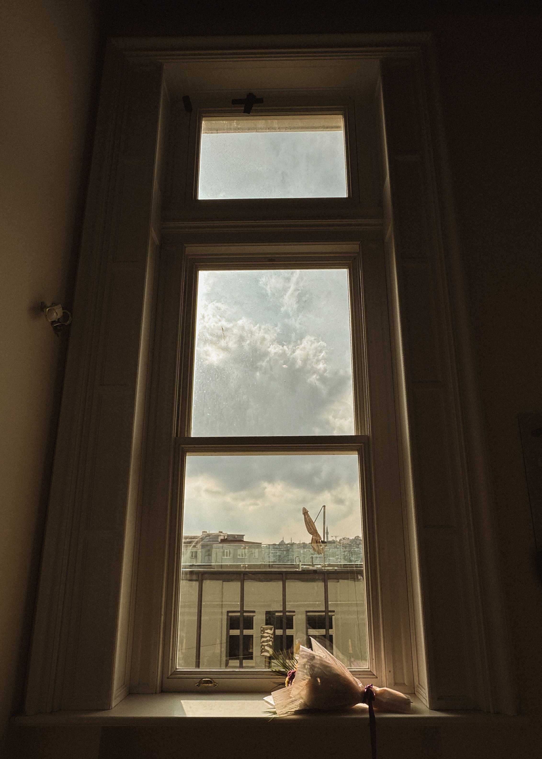 Tall Window View Overlooking Urban Rooftops · Free Stock Photo