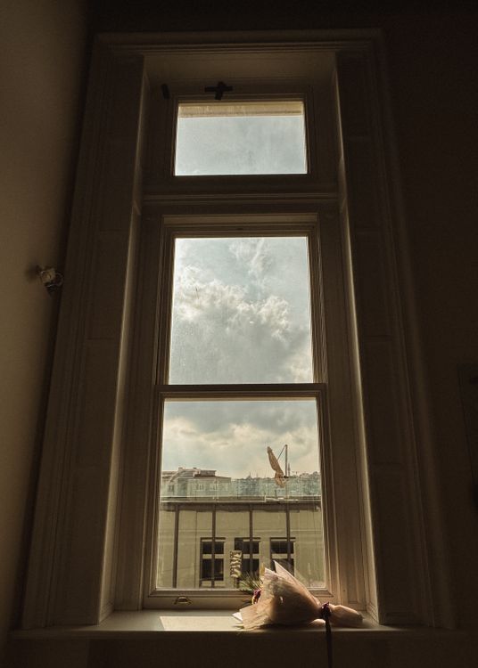 High View Window Tall Window View Overlooking Urban Rooftops · Free Stock Photo