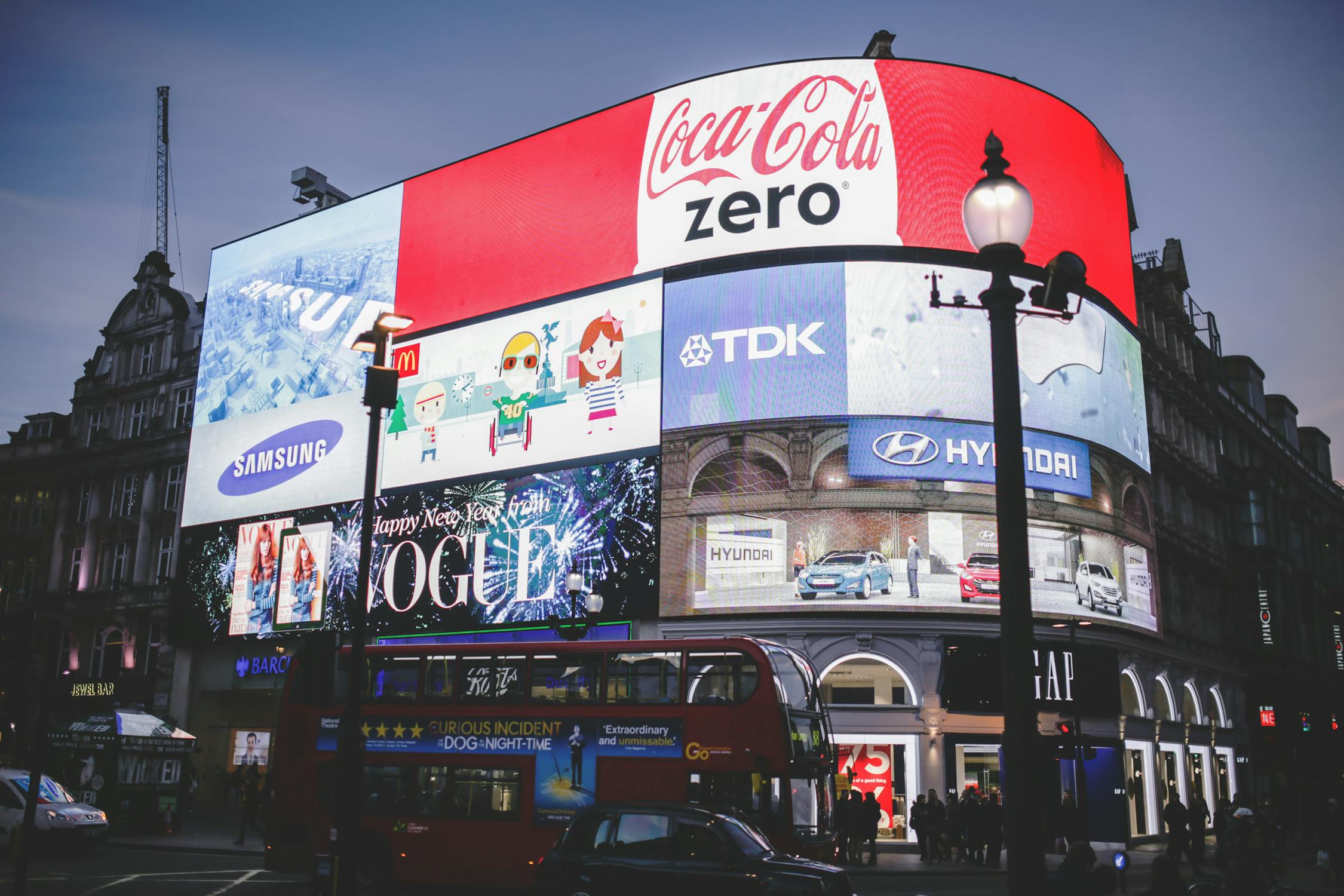 A wall with electronic billboards in the UK